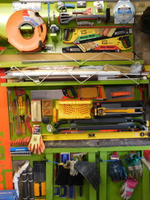 Various tools, to include needle file set, various heavy duty gloves, contractor, spirit level, various saws, Stanley knife. Note: backing boards imaged are not included in the lot.