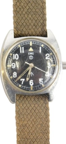 A 1970s CWC military issue wristwatch, with shaped case, luminous hands and markers, chrome case and textured material bracelet, marked 6BB-6645-99 523-8290 686/79 with crow's foot to the face and verso, 4cm wide.