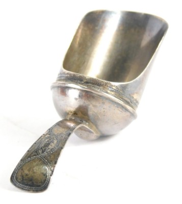 A George III silver caddy spoon, old English pattern with bright cut handle and shaped bowl, Birmingham 1805, 6cm wide.