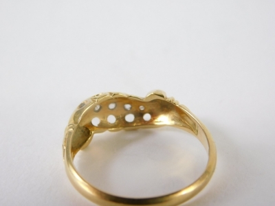 An 18ct gold dress ring, inset with tiny diamonds, 2.4g all in, size M. - 2