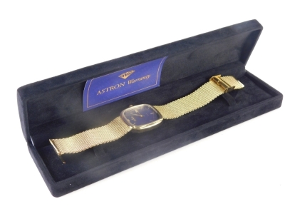 An Astron Eden quartz wristwatch, the 2cm wide oblong face with baton numerals and pointers, with a textured stainless steel bracelet. (boxed with some paperwork) - 2