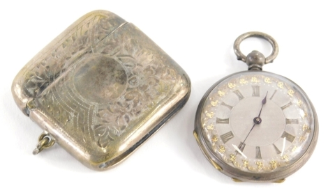 An early 20thC silver plated vesta case, of large proportion, with match strike base and ring hanger to the side, 5cm high, and an early 20thC continental fob watch, partially engine turned, the case marked Fine Silver. (2)