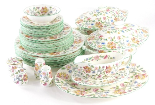 A Minton Haddon Hall part dinner service, to include pair of lidded vegetable dishes, 33cm wide, gravy boat on stand, serving dish, part cruet, plates, side plates, etc., printed marks beneath, part settings for eight.