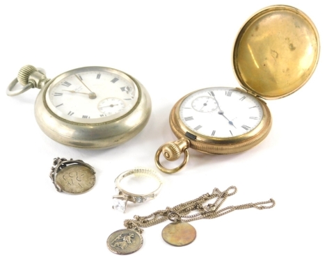 An early 20thC silver plated open faced pocket watch, with fancy etched case, decorated with buildings and trees, with hand wind movement, 5cm diameter Roman numeric dial with substitute Arabic second hand, a gold plated Hunter pocket watch, various fobs,