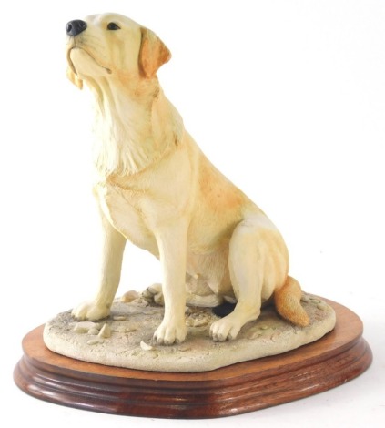 A Margaret Turner Border Fine Arts figure of a Labrador, signed on, wooden plinth, 26cm high.