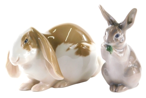 A Royal Copenhagen figure of a rabbit, 1596 HA, 7cm high, and a further figure of a rabbit eating lettuce, 1253/1019. (2)