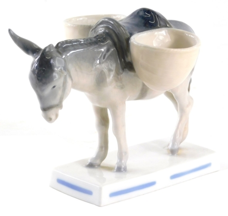 AUCTIONEER ANNOUNCE GREEN MARK A LITTLE WORN. A Royal Copenhagen open salt figure group of a donkey, 607, 14cm high.