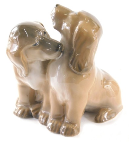 A Royal Copenhagen figure group of two puppies, 1238/2805, 12cm high.