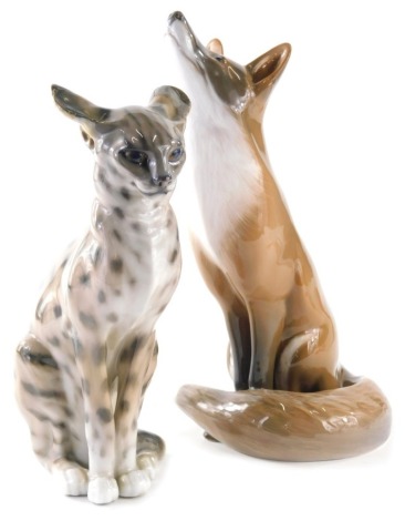 A Royal Copenhagen figure of a wild cat, 2336 163, printed marks beneath, 23cm high, and another fox, 437. (2 AF)