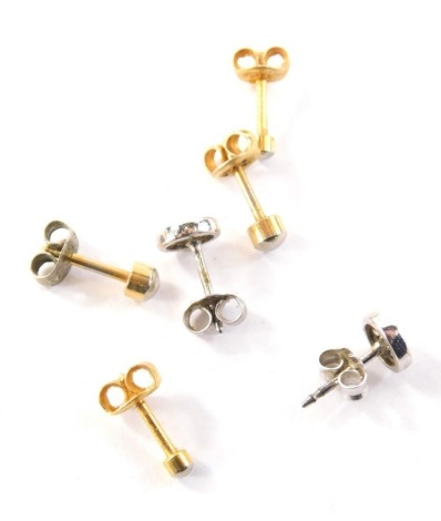 A group of earrings, to include a pair of silver, a cz set cluster earrings, and two pairs of other earrings. (3)