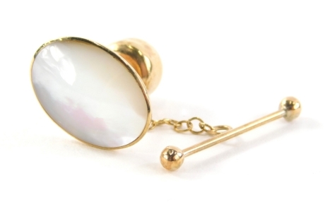 A mother of pearl collar stud, oval on a yellow metal back stamped 9ct, 1.3cm high, with additional safety clip bar, 2g all in.