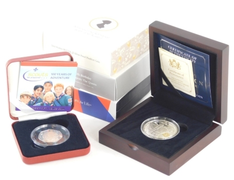 A silver Scouts 50 pence proof coin, a Britannia silver proof 1oz coin Jane Austen Enduring Romance coin, silver proof £5 coin, proof silver half dollar etc. (6)