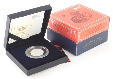 A Shine Through The Ages Sapphire Jubilee £5 silver proof coin, a Lunar Year Of The Rat one ounce silver proof coin and a Shape Of The Revolution silver 50 pence. (3 boxed with paperwork)