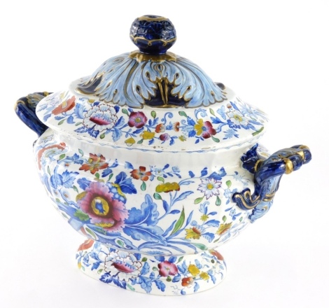 A 19thC pearlware tureen, of oval form, with domed lid, profusely decorated with flowers with gilt highlights, unmarked, 27cm high.