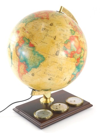 A modern Danish terrestrial globe, with electric feature and wooden plinth base, 36cm high.