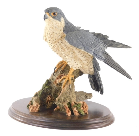 A Brooks & Bentley figure, kestrel on tree bough, 30cm high.