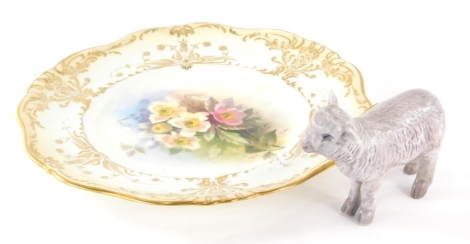 A Bing and Grondahl Copenhagen figure of a sheep, 8cm high, and a Doulton Burslem wall plate, hand painted with flowers, with gilt rim. (2)