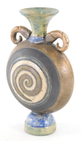 A 20thC Studio pottery vase, by Eleanor Newhall, the circular body with compressed trumpet stem and moulded handles, decorated with swirl pattern, signed, 18cm high.