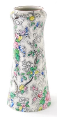 An early 20thC Coronaware Rosetta pattern vase, transfer printed with flowers, 23cm high.