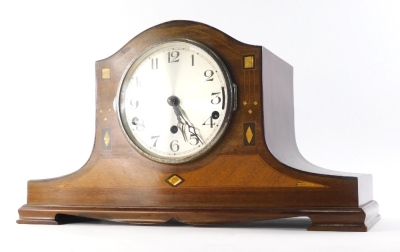 A mid 20thC mahogany Napoleon hat chiming mantel clock, the 14cm diameter, Arabic dial held in a shaped partially inlaid case, on squat feet, with chiming eight day movement, 27cm high.