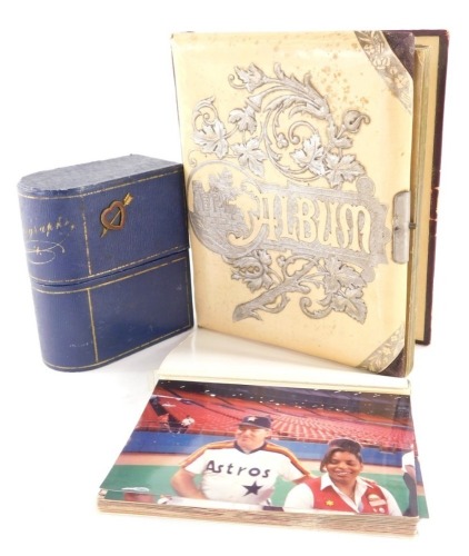 An early 20thC photograph album, with fancy stencilled cover lacking contents, a photograph and a small quantity of photographs of baseball players. (a quantity)