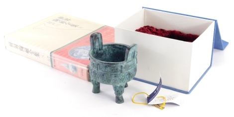 A boxed Chinese censer, 13cm high and a book in slip case.