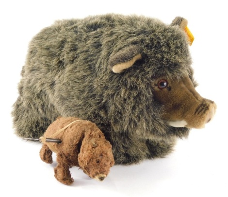 A Modern Steiff warthog and a clockwork bear, with pressed fur and metal body, 6cm high. (2)