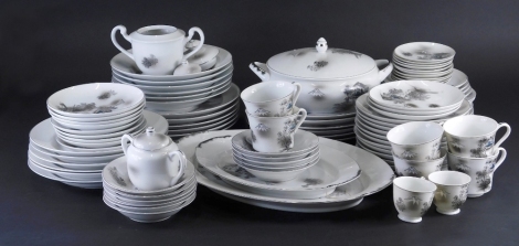 A comprehensive 20thC Japanese dinner service, to include lidded tureen, 28cm wide, plates, side plates, cups, saucers, each decorated with buildings and mountains, marked beneath. (a quantity)