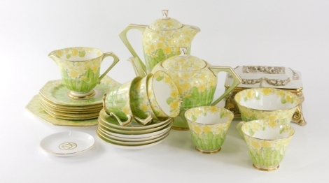 A 20thC Paragon floral decorated Art Deco tea service, decorated with yellow and green flowers, to include coffee pot, 23cm high, teapot, cups, saucers, serving plate and side plates, a further Capodimonte jar and a Wedgwood saucer, various marks. (a quan