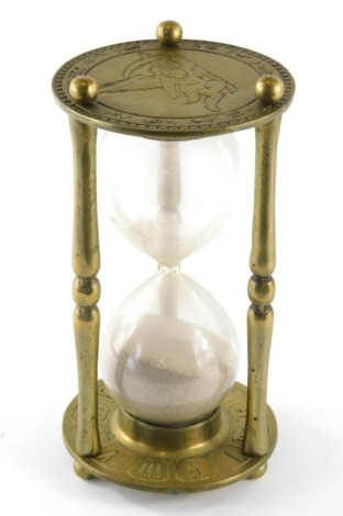 A 20thC brass and glass egg timer, of large proportion with figure of eight centre, 26cm high.