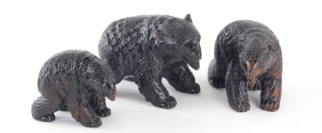 A graduated set of three Black Forest style carved bears, each standing 10cm high, etc. (3)