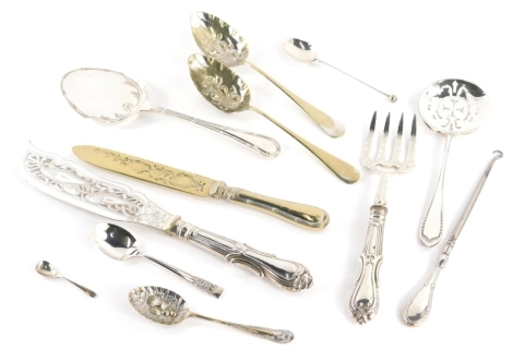 Various silver handled and other cutlery, pair of fish servers, one with pierced shaped blade, 33cm wide, various teaspoons, button hook, etc., some silver plate. (a quantity, various and makers)