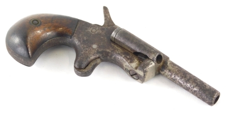 An early 20thC starting pistol, with wooden handle and metal mounts.