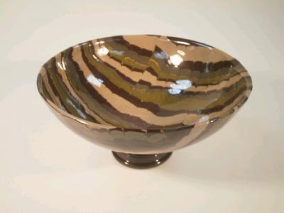 A modern art pottery bowl of faux agate design