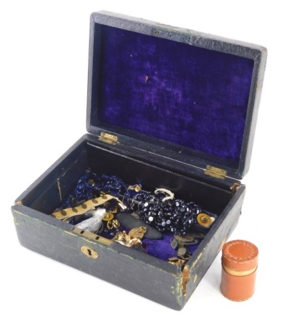 A pressed Edwardian leather jewellery box, with flush handle, containing a quantity of costume jewellery, Richard Grosse bracelet, various other costume jewellery, etc., the jewellery box 24cm wide.