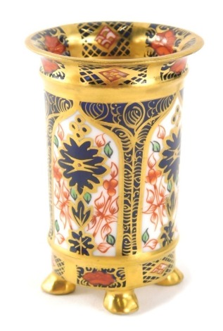 A Royal Crown Derby Imari pattern cylindrical vase, number 1128, on four feet, printed marks beneath, 7cm high.