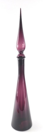 A 1960s Italian style amethyst coloured glass decanter, of tapering form with elaborate stopper, pharmaceutical style, 67cm high.