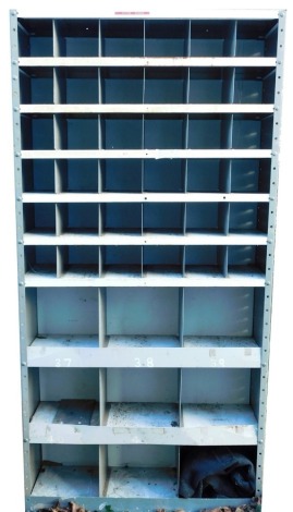 A set of industrial shelving, with pigeon holes, (AF), 177cm high, 92cm wide, and a tin trunk, bearing initials RHH/