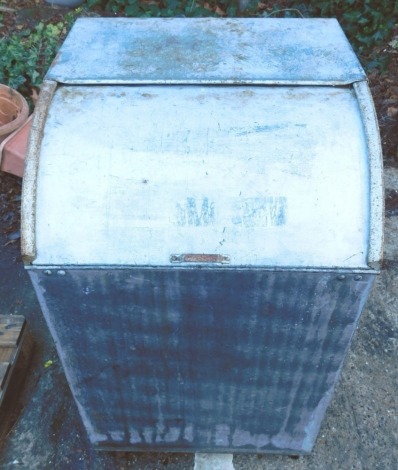 A galvanised workshop bin or container, with sliding lid, on castors, 96cm high, 57cm wide.