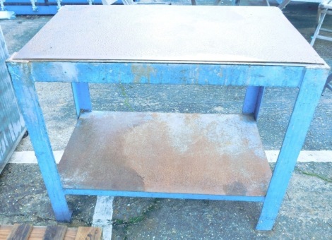 A steel engineers workshop bench, with loose top, the base and under tier painted blue, 88cm high, 104cm wide, 63cm deep.