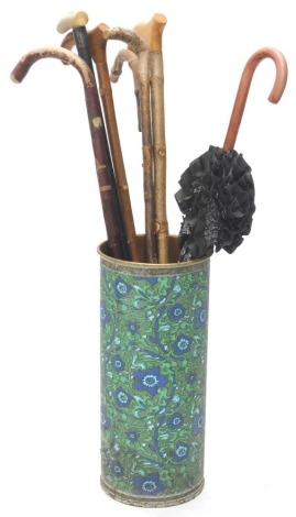 An ebonised and horn walking stick, with engraved silver coloured metal collar, other walking sticks and a 1960s/70s umbrella stand.