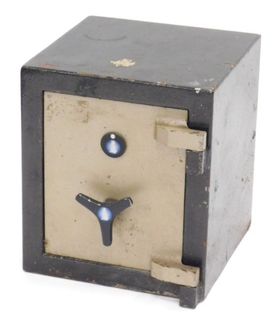 A small metal safe, painted in black and silver, with a key, 41cm high, 35cm wide, 35cm deep.