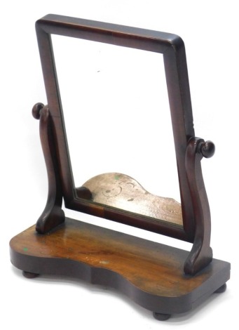 A Victorian mahogany dressing table mirror, with rectangular plate on a shaped base, 45cm wide.