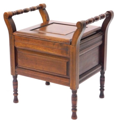 A late 19th/early 20thC walnut commode, the hinged panelled lid enclosing a ceramic pot with lid, on turned legs, 53cm wide.