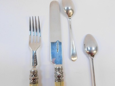 A small group of silver wares, comprising a pair of silver and ivory handled knives and forks, the ivory handles with beaded detailing and bearing the initial H, with silver ferrules, Elkington & Co, Sheffield 1890, together with a silver golfing teaspoon - 4