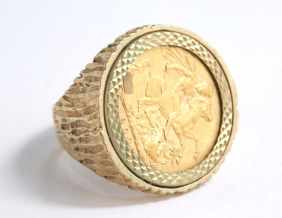 A Victorian gold full sovereign ring, in a textured 9ct gold setting, size V, 18g all in. - 3
