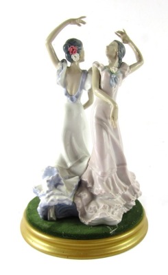 A Lladro porcelain figure group of two flamenco dancers, no 5601, printed and painted marks, on a gold painted base, 30cm high.