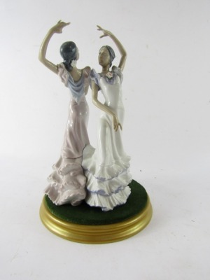 A Lladro porcelain figure group of two flamenco dancers, no 5601, printed and painted marks, on a gold painted base, 30cm high. - 2