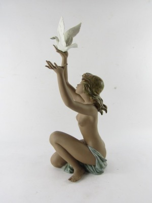 A Lladro matt porcelain figure of a nude lady, modelled kneeling holding aloft a dove, no 3559, printed and impressed marks, 53cm high. (AF) - 4