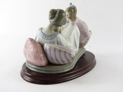 A Lladro porcelain figure group depicting mother and baby with child, no 1606, printed and impressed marks, on an oval wooden base, 20cm high, 23cm wide. - 3